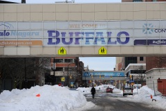 BUFFALO, NY - DECEMBER 28: Pedestrians walk along Ellicott Street in downtown Buffalo on December 28, 2022 in Buffalo, New York. The historic winter storm Elliott dumped up to four feet of snow on the area leaving thousands without power and thirty confirmed dead in the city of Buffalo and the surrounding suburbs. (Photo by John Normile/Getty Images)