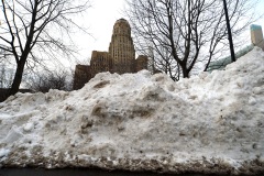 BUFFALO, NY - DECEMBER 28: City Hall stands tall behind mounds of snow on December 28, 2022 in Buffalo, New York. The historic winter storm Elliott dumped up to four feet of snow on the area leaving thousands without power and thirty confirmed dead in the city of Buffalo and the surrounding suburbs. (Photo by John Normile/Getty Images)