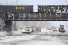 HAMBURG , NY - December 24: Plows work to clear ice and snow along the Lake Erie shoreline on December 24, 2022 in Hamburg, New York. The Buffalo suburb and surrounding area was hit hard by the winter storm Elliott with wind gusts over 70 miles per hour  battering homes and businesses through out the holiday weekend.  (Photo by John Normile/Getty Images)