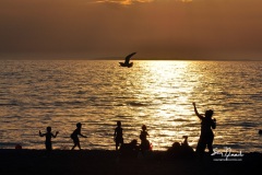 Hamburg, NY-June16: Love Curry (R) and her family enjoy sun and surf at Hamburg Beach as warmer temperatures return to the Southtowns and Western New York. Photo by John Normile