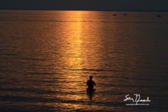 Hamburg, NY-May 29, 2015: A fisherman dots the waters of Lake Erie near Buffalo, New York. Known for its blustery winters and lake effect snow bands. The Buffalo and upper Niagara river region boasts of warm summers with ample recreational opportunities including restaurants, music festivals, boating, and some of the best freshwater fishing in the world. Miles of shoreline offer access for trophy sized Smallmouth bass, walleye, perch, Steelhead trout and a variety of other species. John Normile/Getty Images